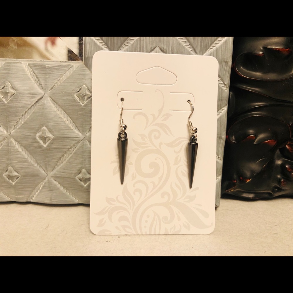 Matching black spiked earrings